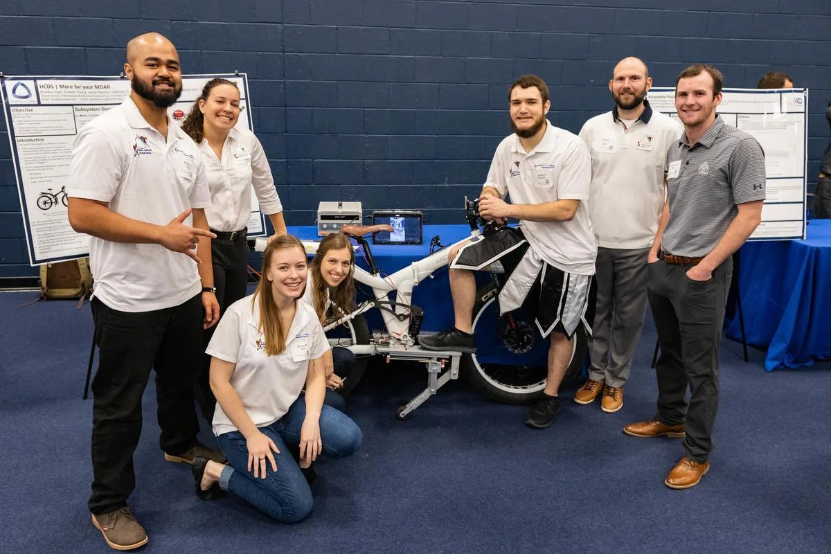 Mines students posing for a photo with their Capstone project