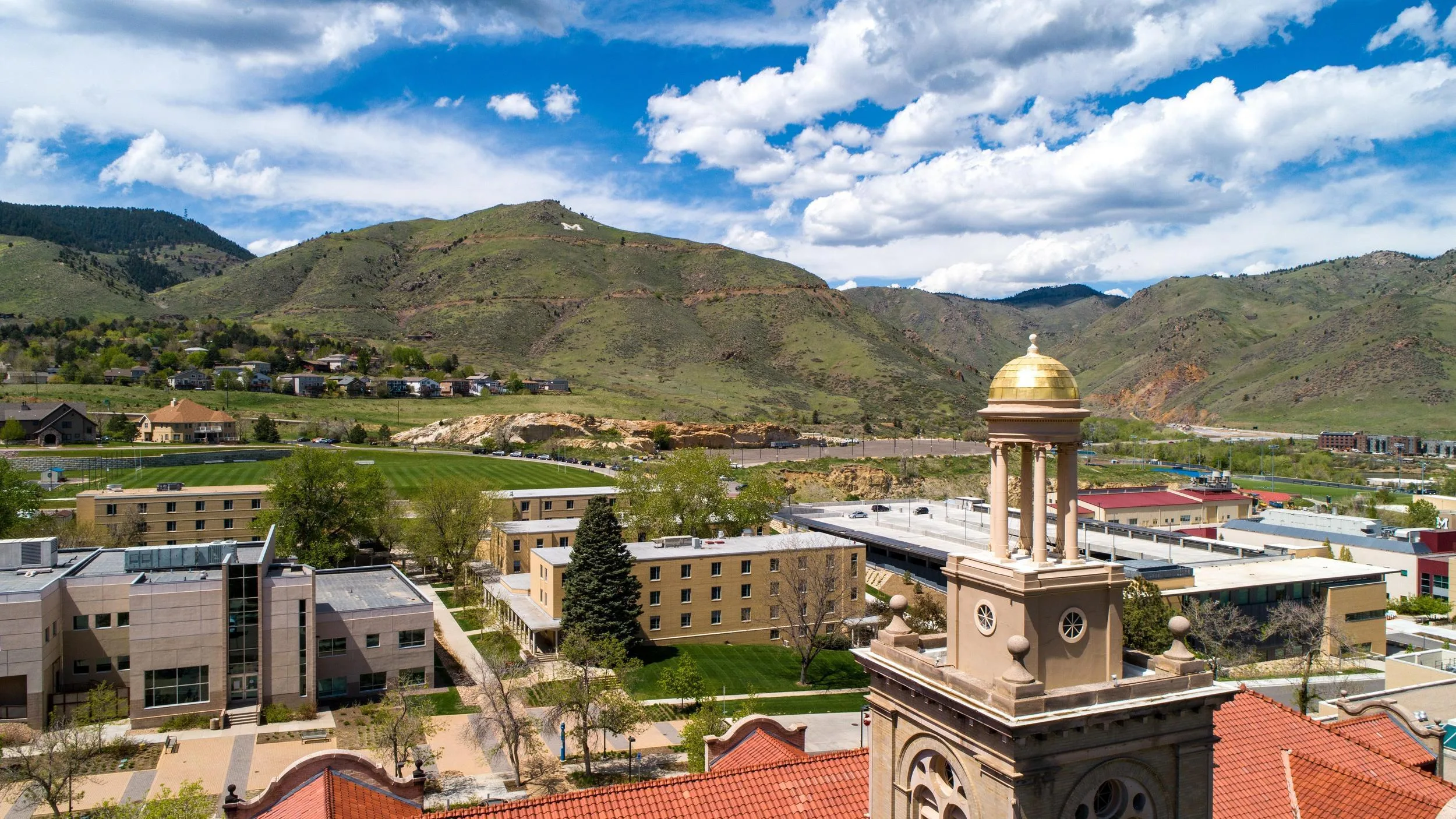 Aerial of Mines Campus with blue sky with clouds and guggenheim in the front