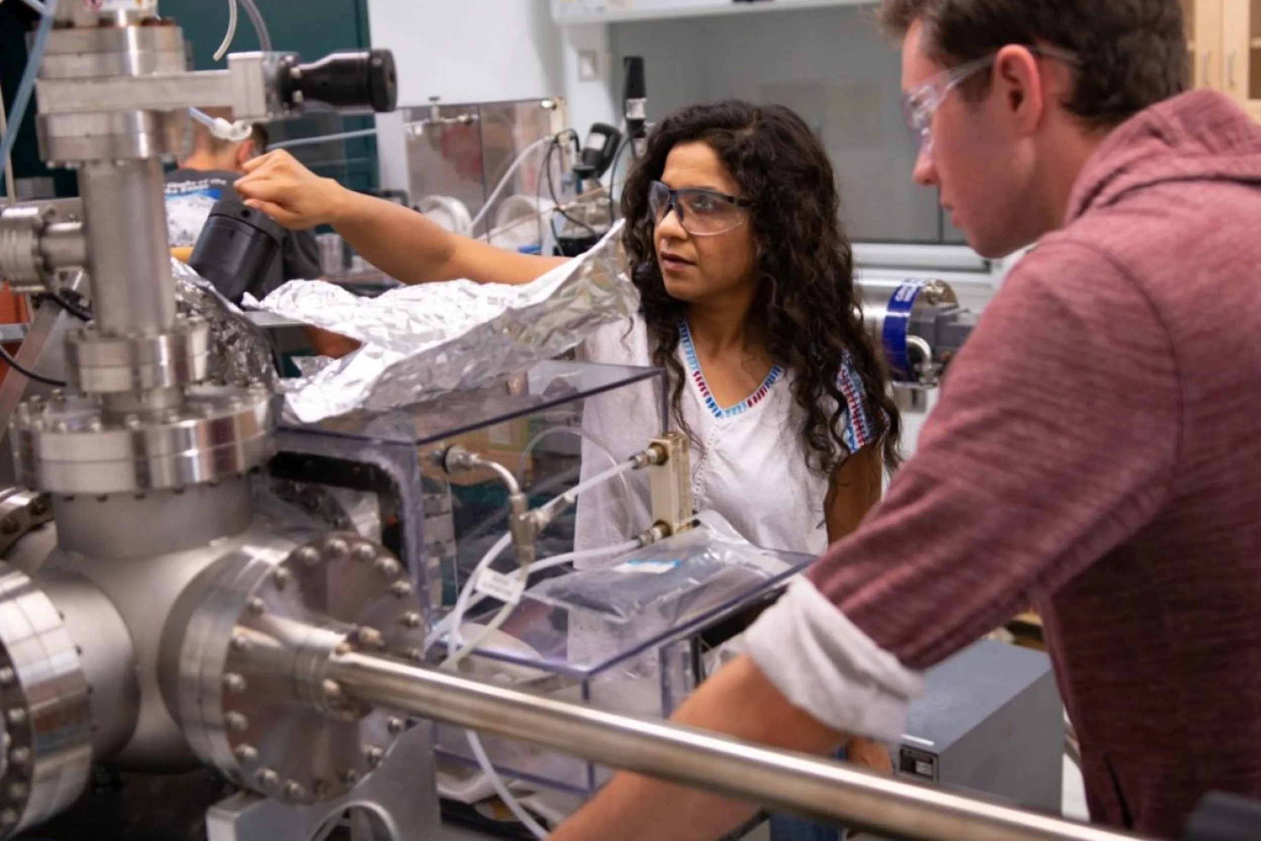 Researchers working in a quantum physics lab