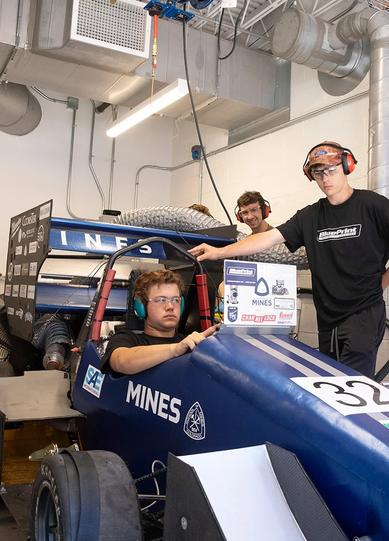 Mines students working on their Formula SAE car