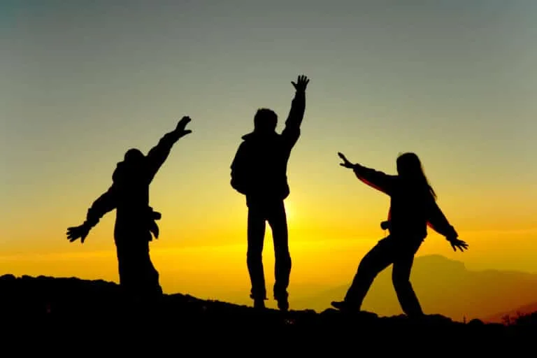 Students hiking at sunset