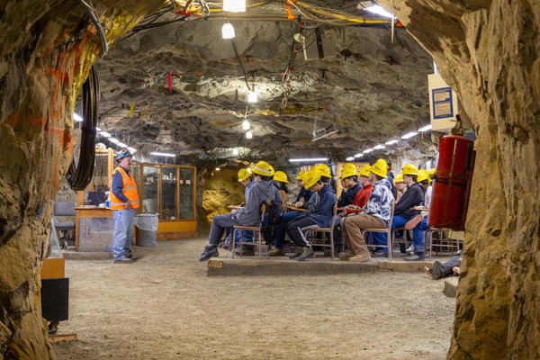 Colorado School of Mines students in hard hats sit at desks for a class inside the Edgar Experimental Mine