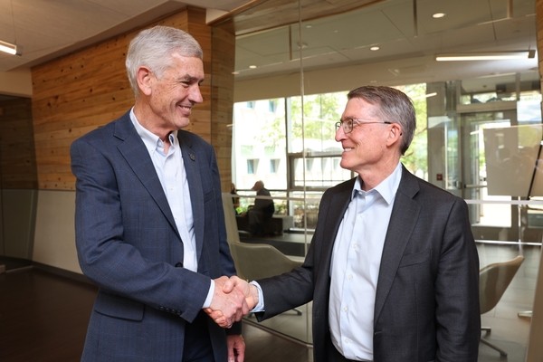Mines President and NLR Laboratory Director shake hands