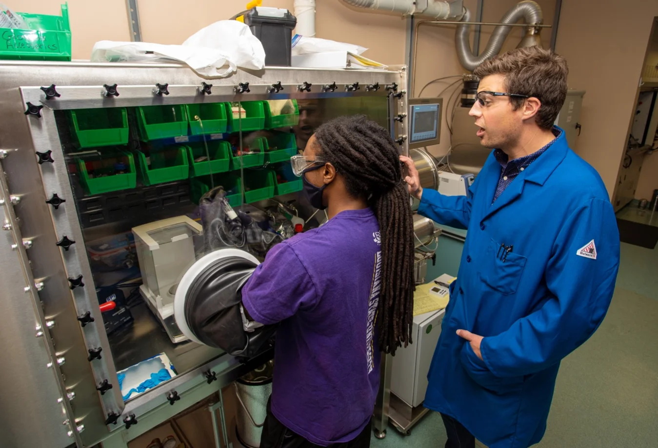 Chemistry graduate student Darius Hayes works in the glovebox in the McGuirk Lab, which focuses on interdisciplinary research at the interface of synthetic chemistry and materials science — including carbon capture.