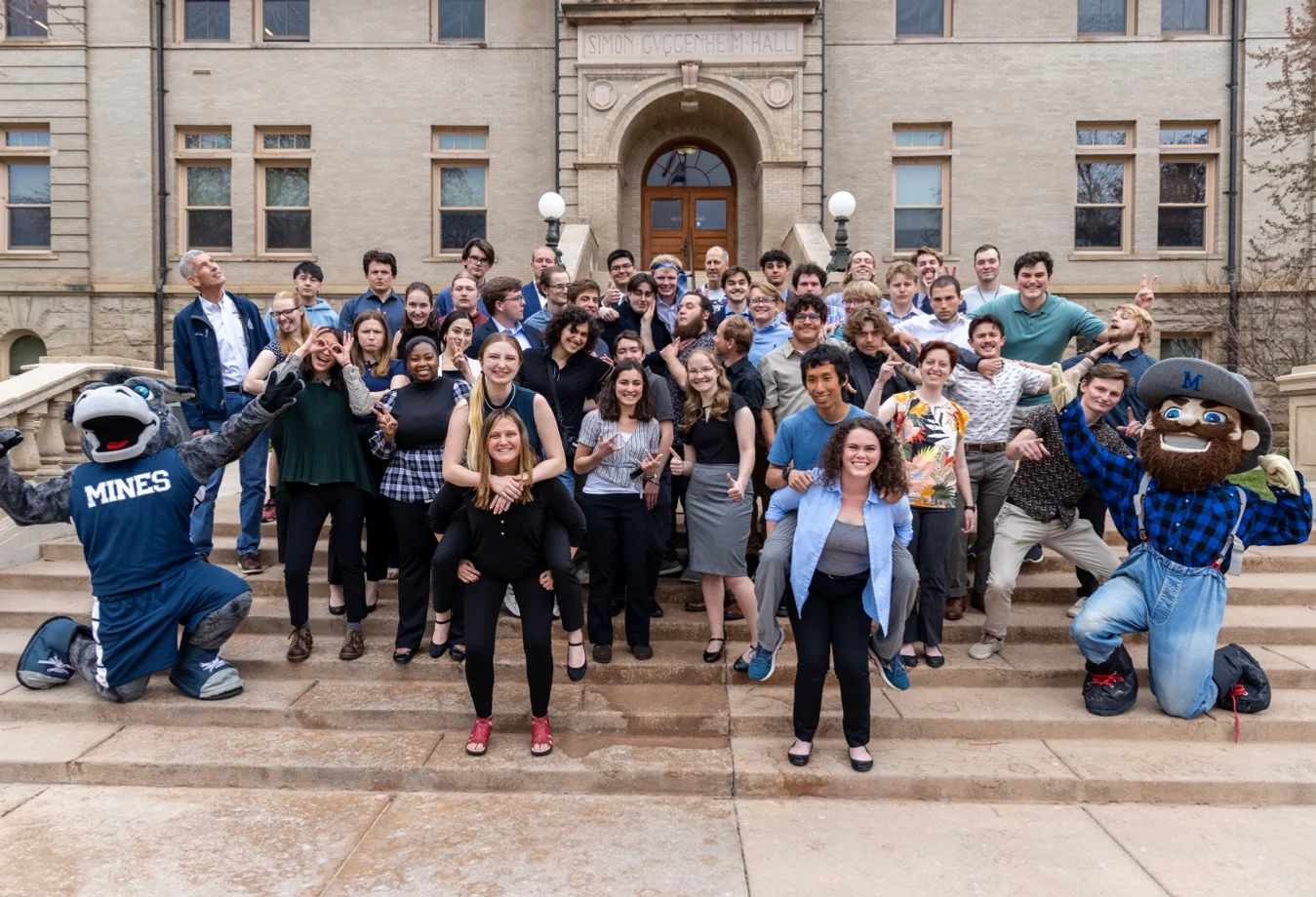 President Paul Johnsons and Mines Faculty with Students standing in front of Simon Guggenhiem Hall