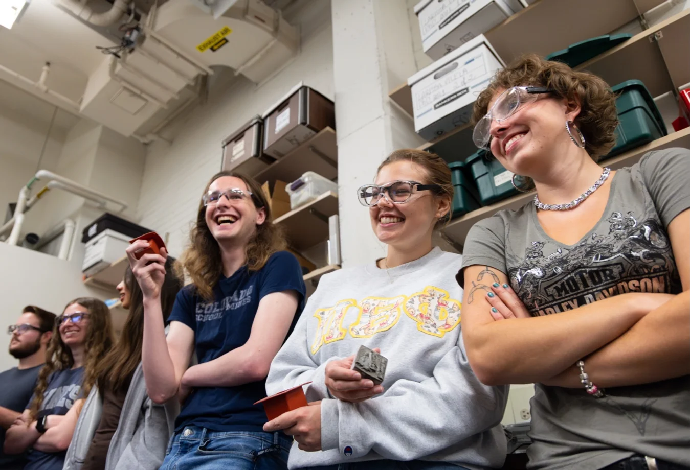 Shows students in a laboratory setting, with many visible in the selected region