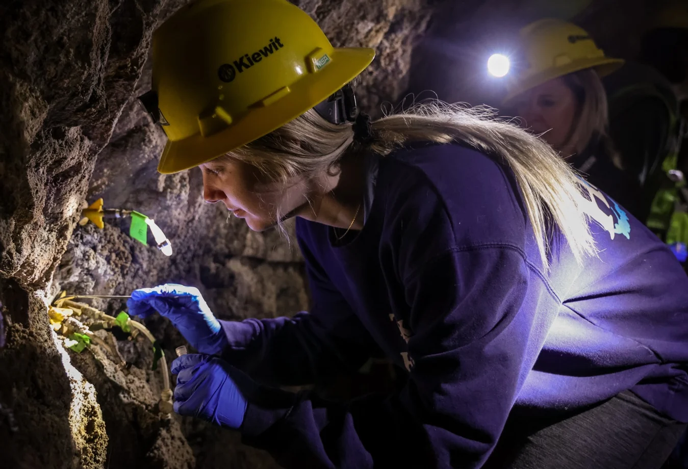 A female student conducting research at the Edgar Experimental Mine in Idaho Springs, Colorado, during the inaugural field session for the Colorado School of Mines' Quantitative Biosciences and Engineering program