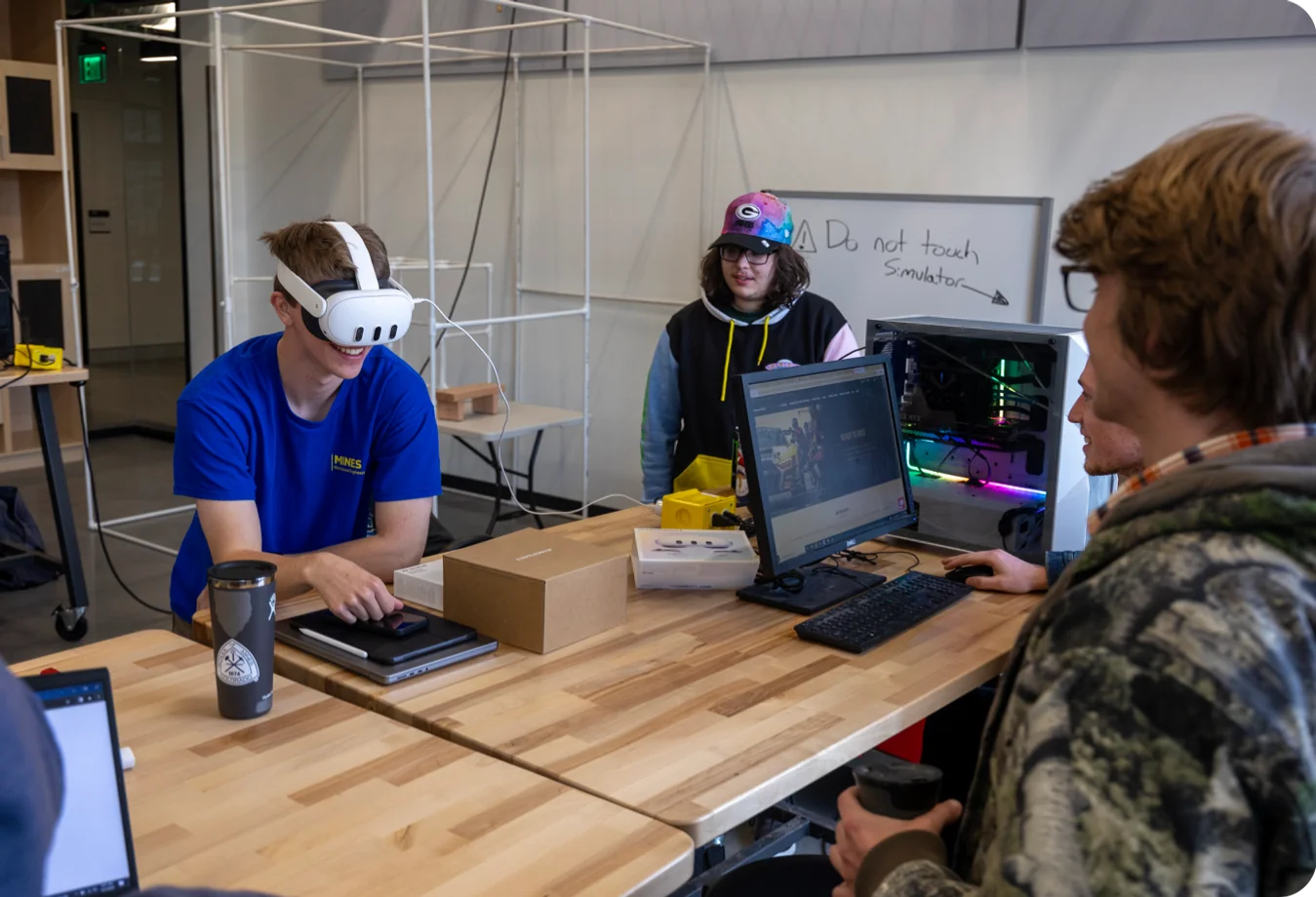Students Henry Bryndal, Matthew Dyer and Mathew Grossman work on a Capstone Design project focused on restoring a six-axis motion racing simulator for use in automotive classes and for Formula SAE.