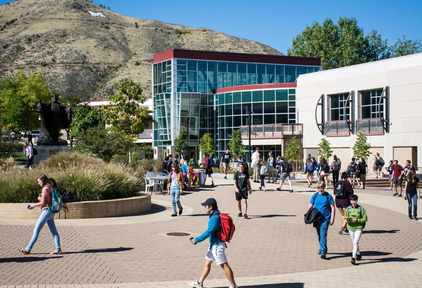 Mines students walk in front of the Ben H. Parker Student Center on campus many of whom have received financial aid.