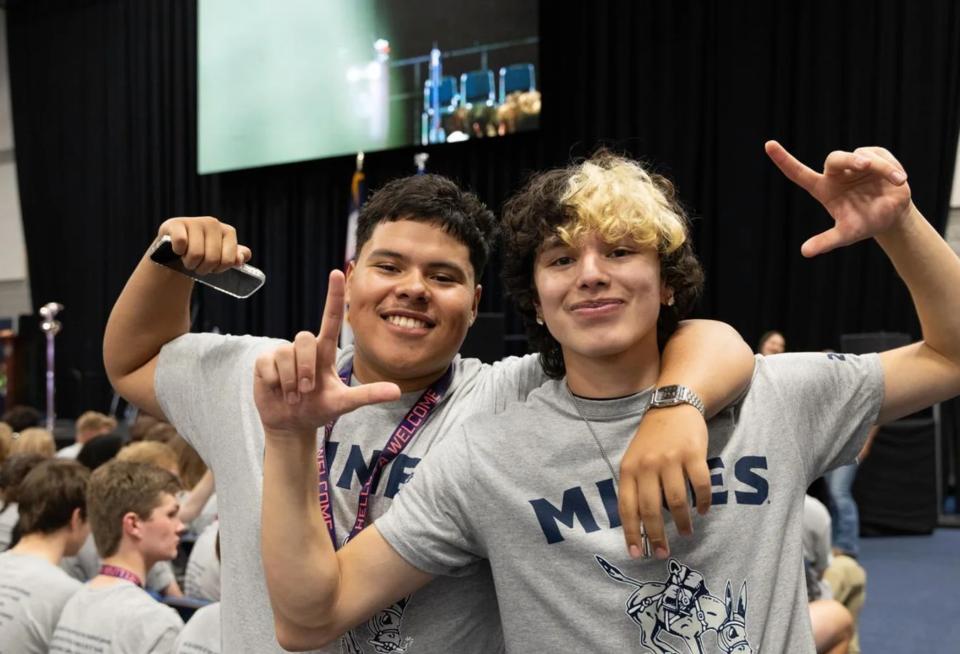 Two smiling students wearing 