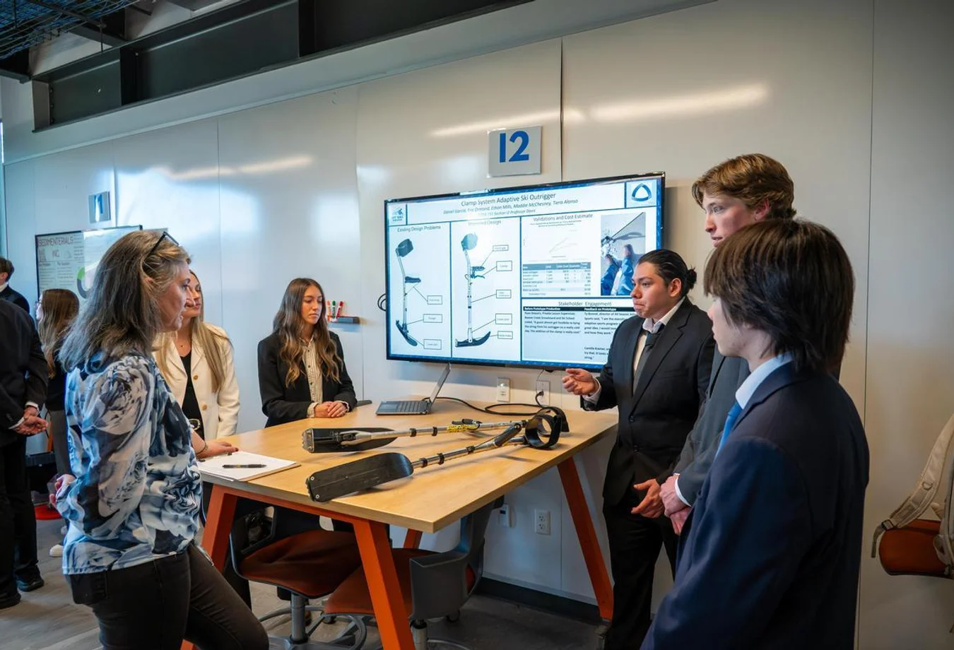 A team of Mines undergraduate students present their designs for a newly engineered adaptive ski outrigger.