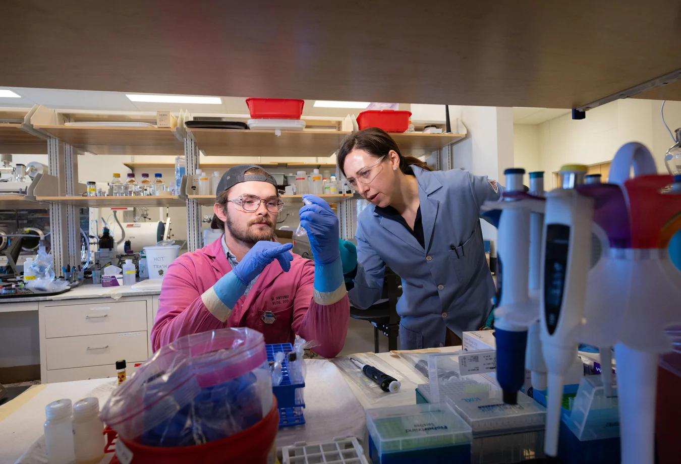 A man and a woman in a lab working together.