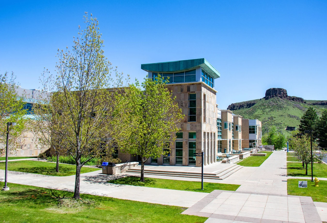 A large building with a green roof on top of it.