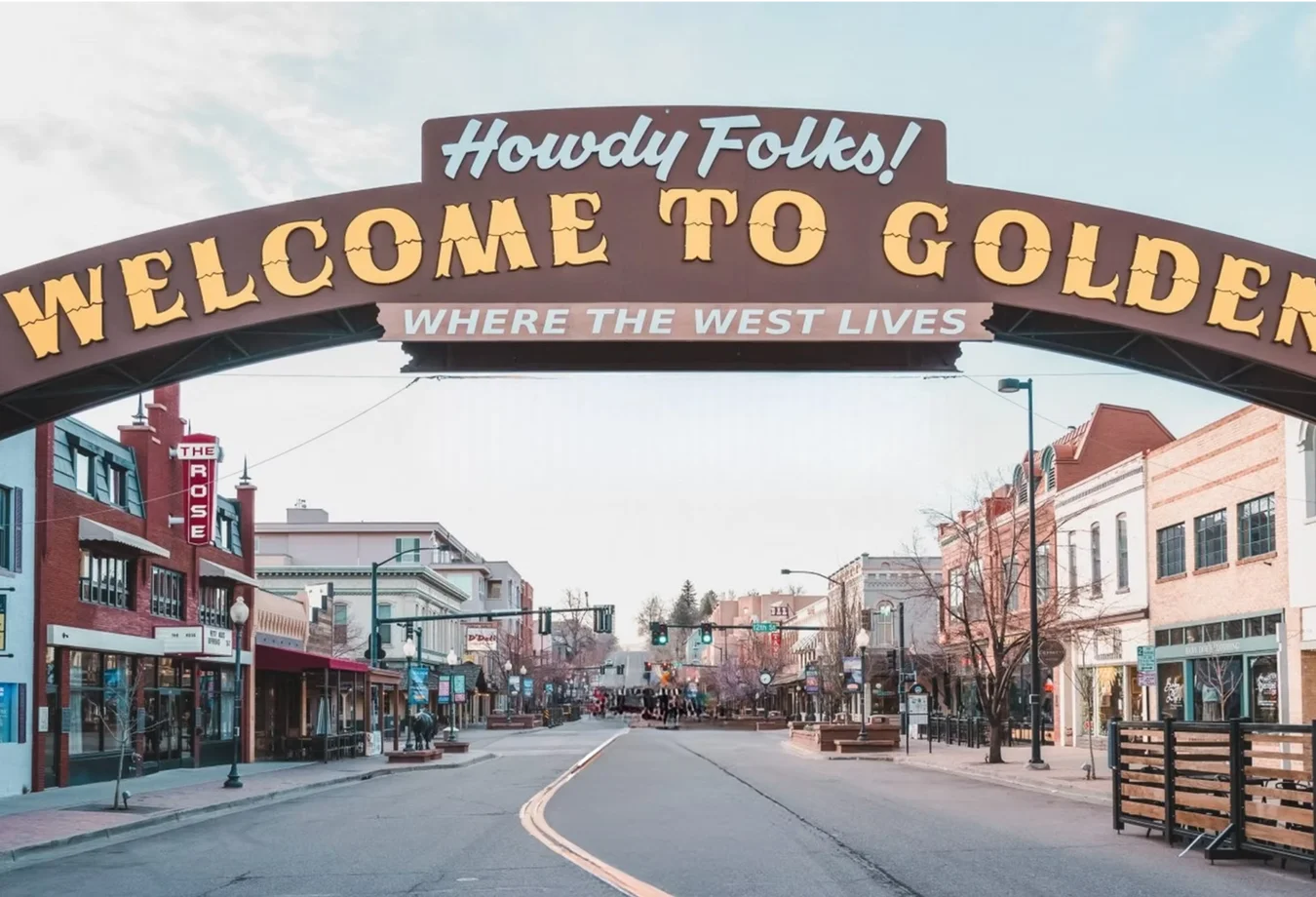 Arch sign stretching over Main Street in Mines' hometown that reads Howdy Folks Welcome to Golden