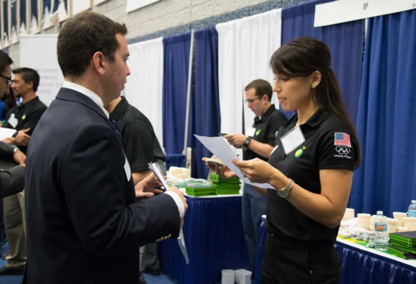 Mines student sharing a resume at the Career Fair