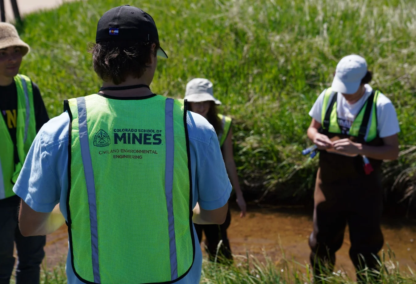 Colorado School of Mines Civil and Environmental Engineering students working in the creek bed.
