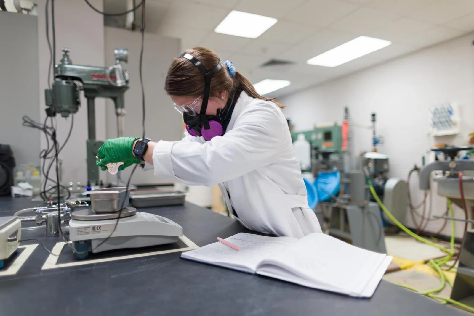 Mines PhD student Karlie Hadden MS ’24 weighs out a sample of sparamine concentrate to run through a RO-tap machine.