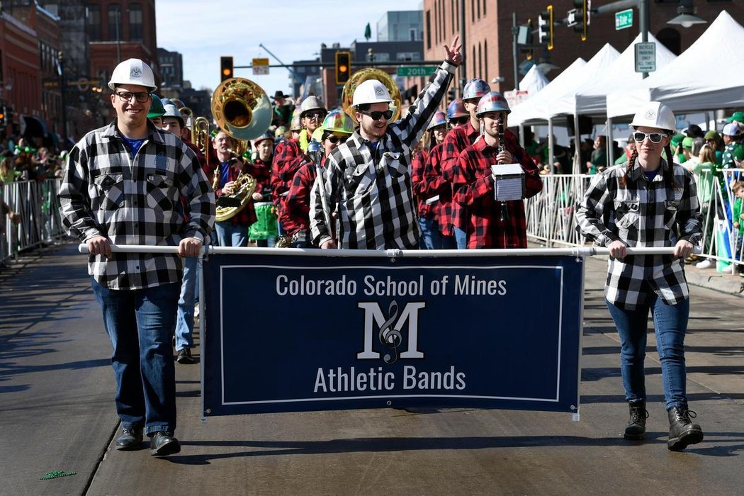 Mines marching band at a parade in Denver