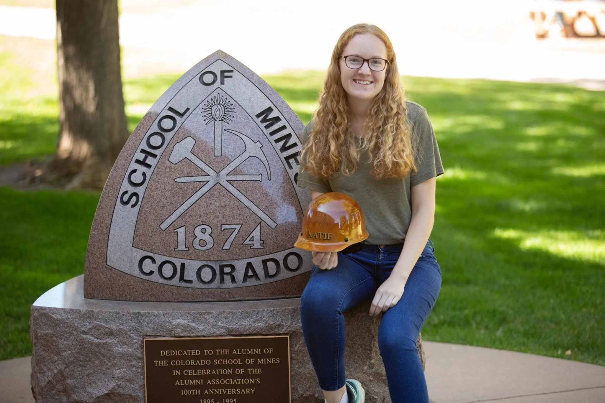 katie varnadoe headshot near the Colorado School of Mines crest