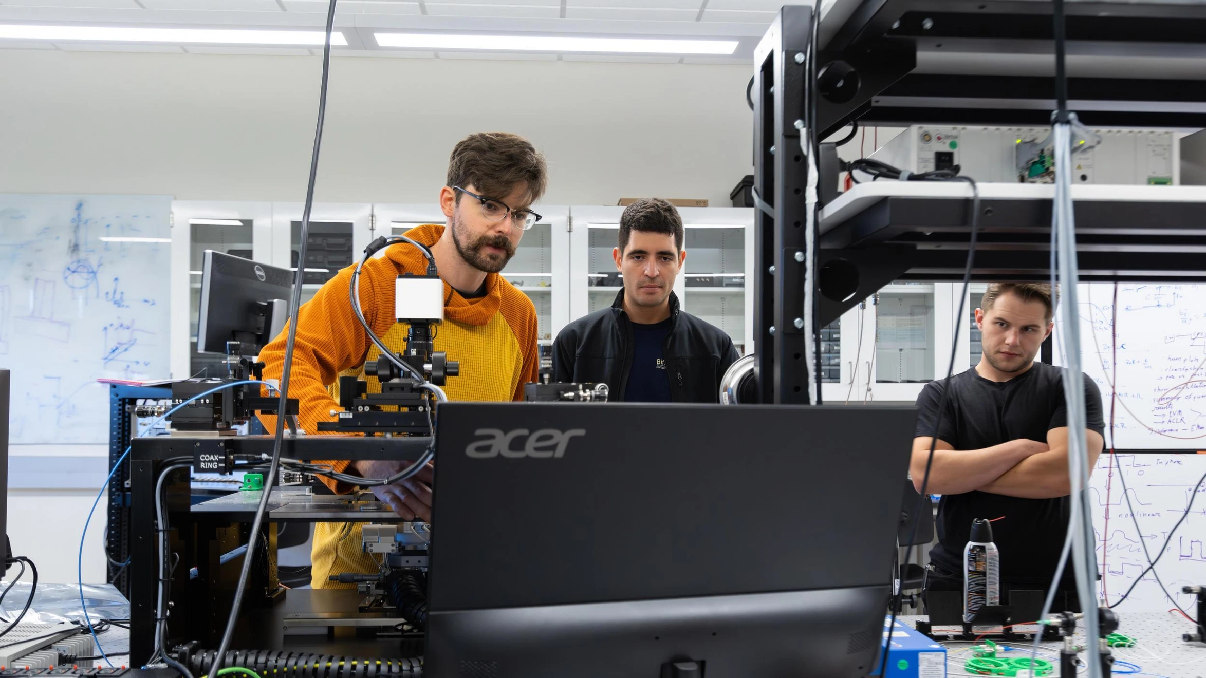 Students in a lab performing Electrical Engineering microwave experiments.
