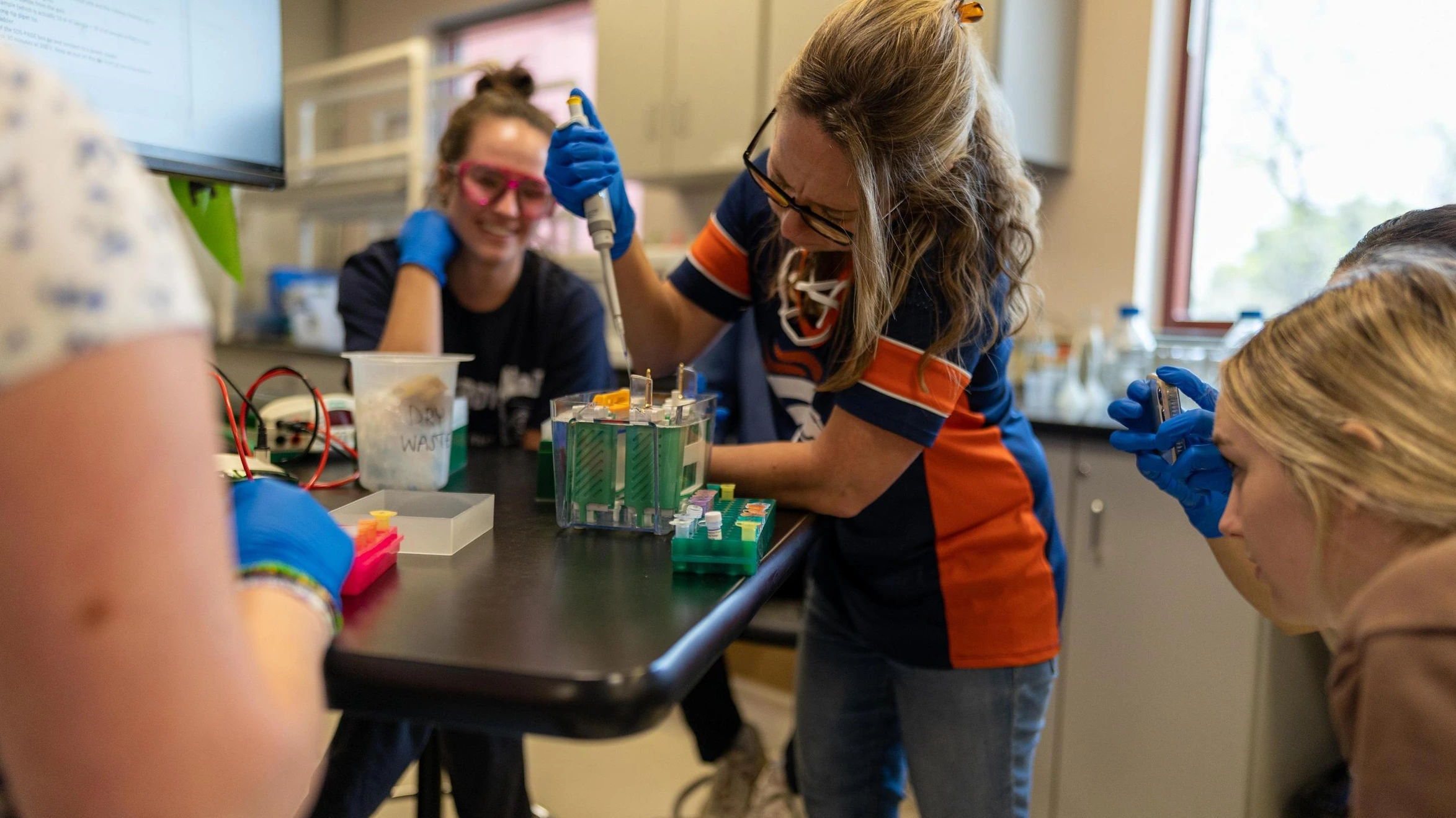 A group of young people working in a lab.