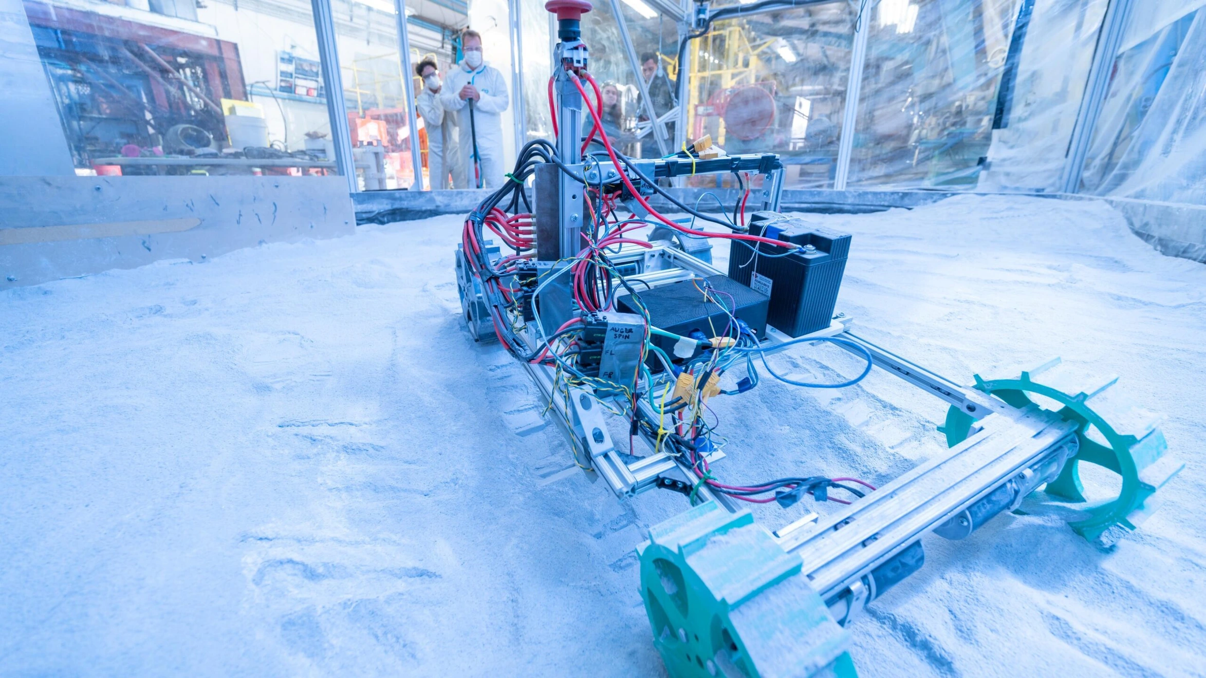 A robot that is sitting in the snow.
