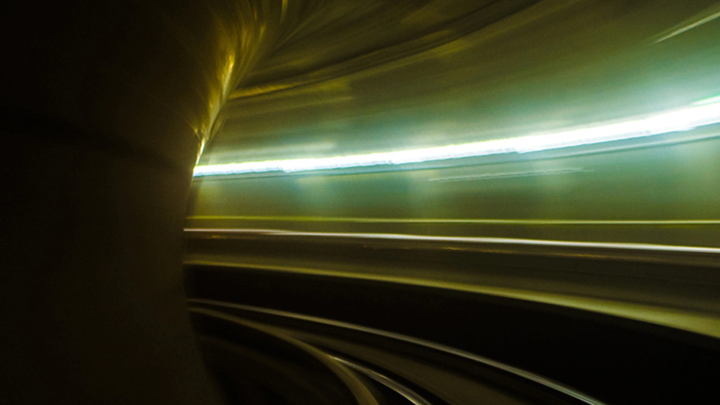 A long exposure shot of a train going through a tunnel.