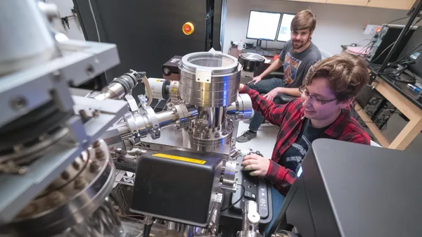 Mines Geochemistry students work in a lab analyzing samples collected from the field.