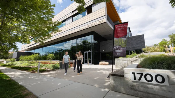 Mines students who are part of the business and economics programs at Mines exit the Beck Venture Center coworking space.