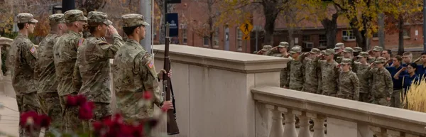 Army ROTC at Mines standing at attention for the Reveille ceremony.