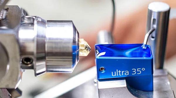 a close up of a metal object on a machine.