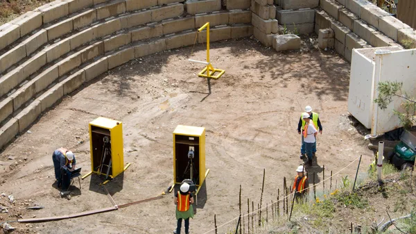A group of construction workers working on a construction site.
