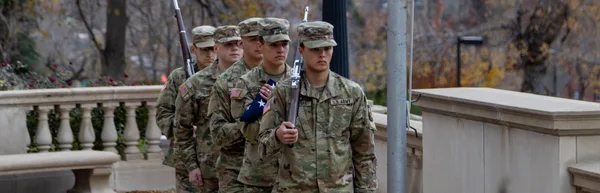 The Army ROTC color guard returning from Retreat.