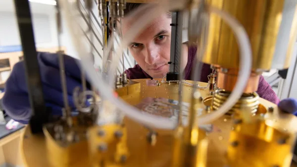 A man working on a machine in a laboratory.