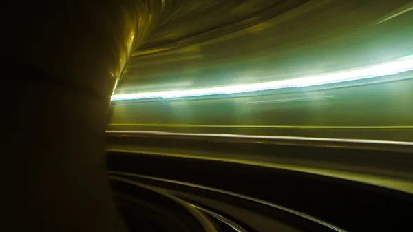 A long exposure shot of a train going through a tunnel.