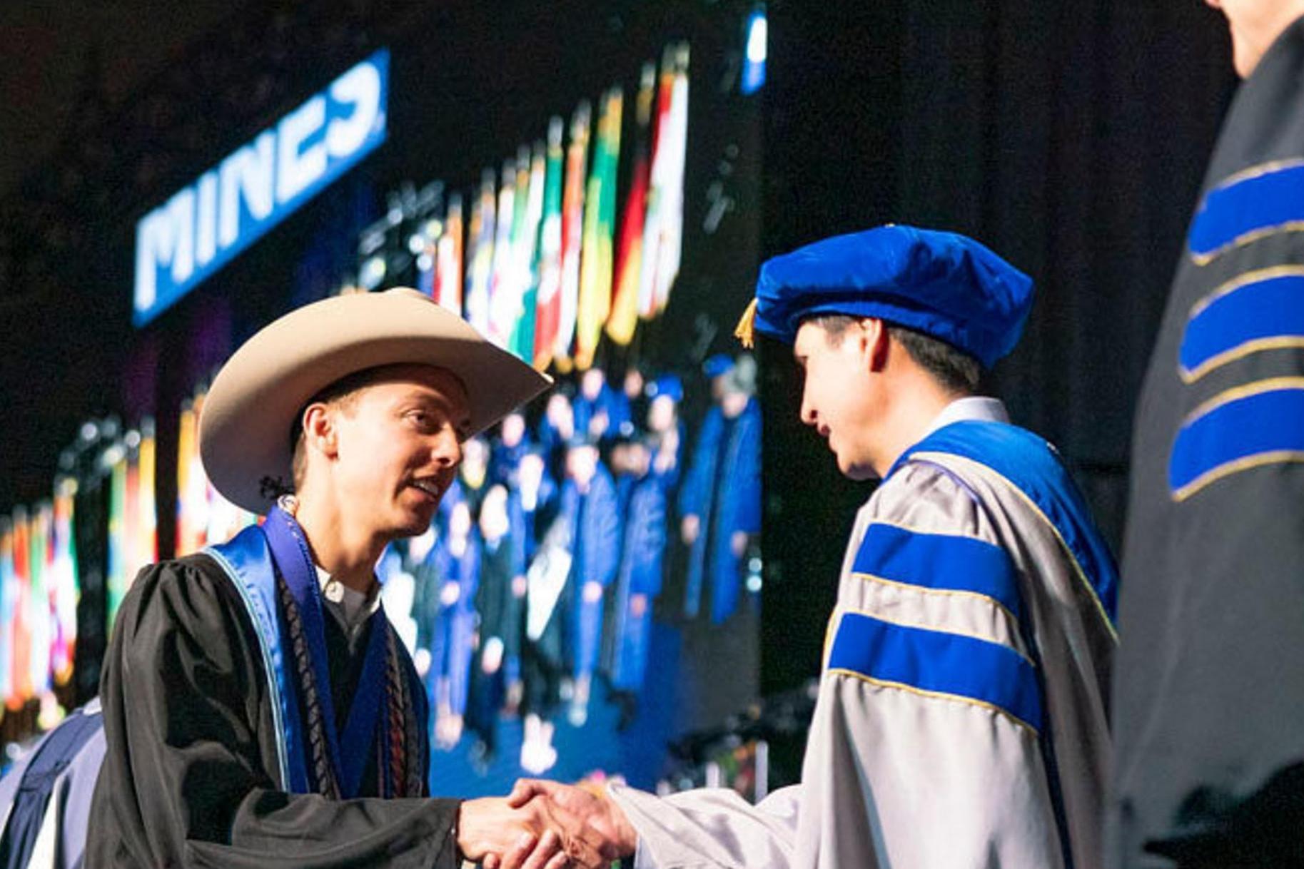 Student crosses the stage at Undergraduate Commencement Spring 2024
