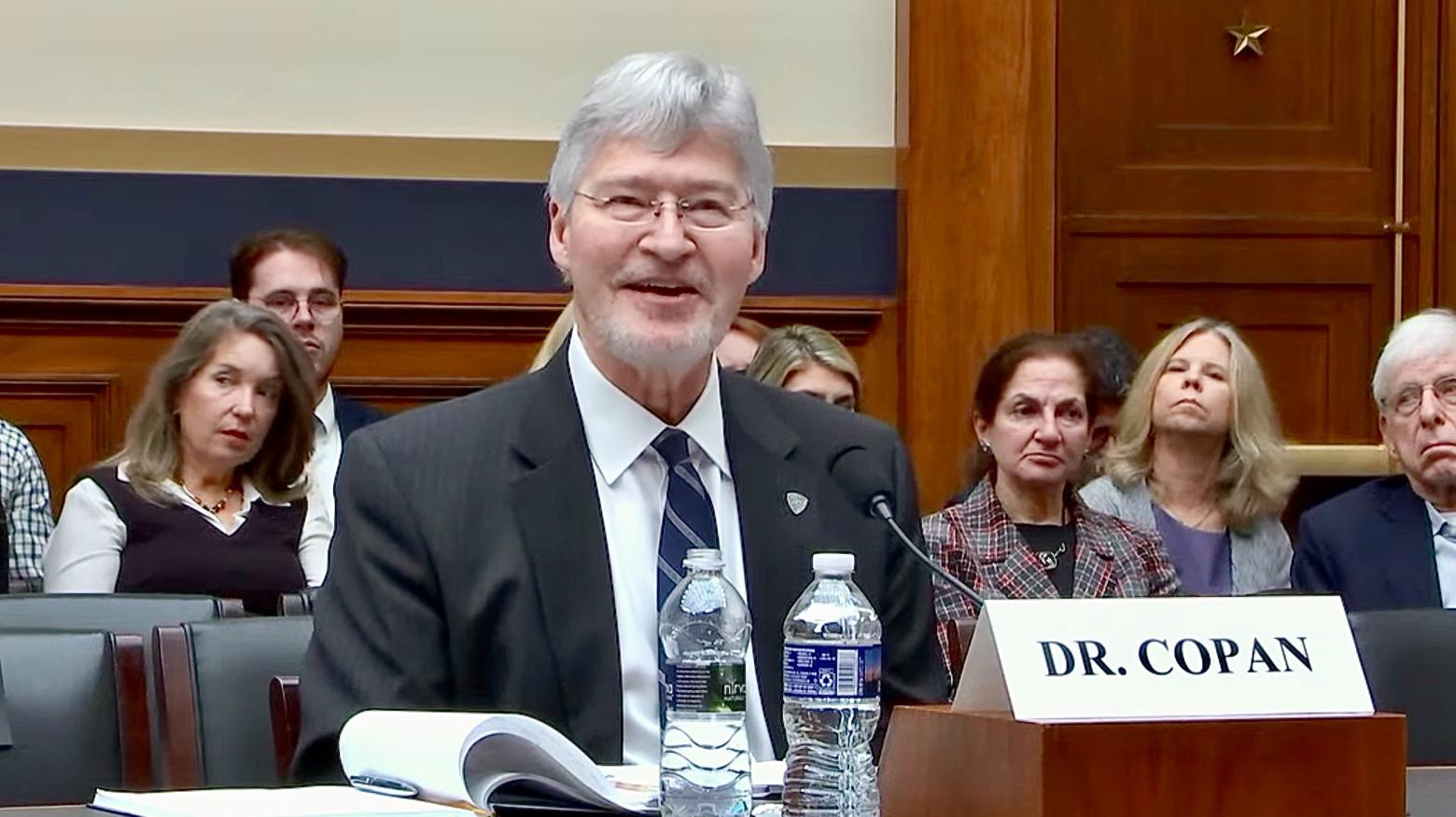 Walt Copan sits at a table testifying before Congress
