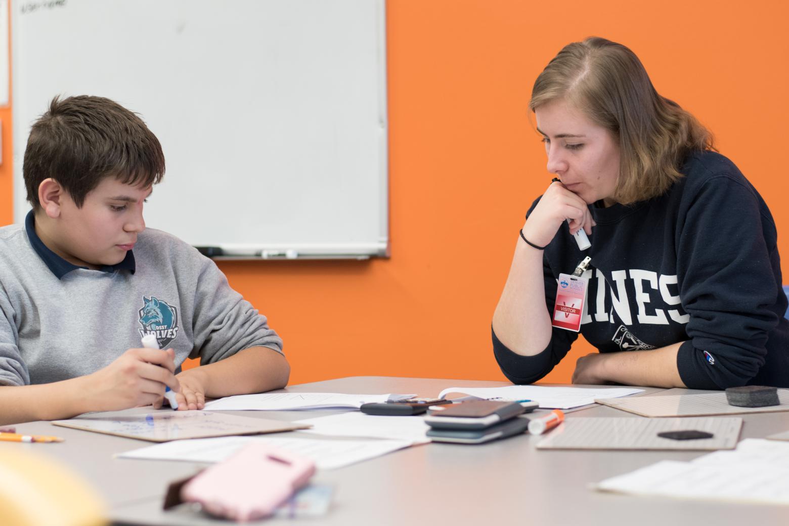 Teach@Mines student tutoring a middle school student