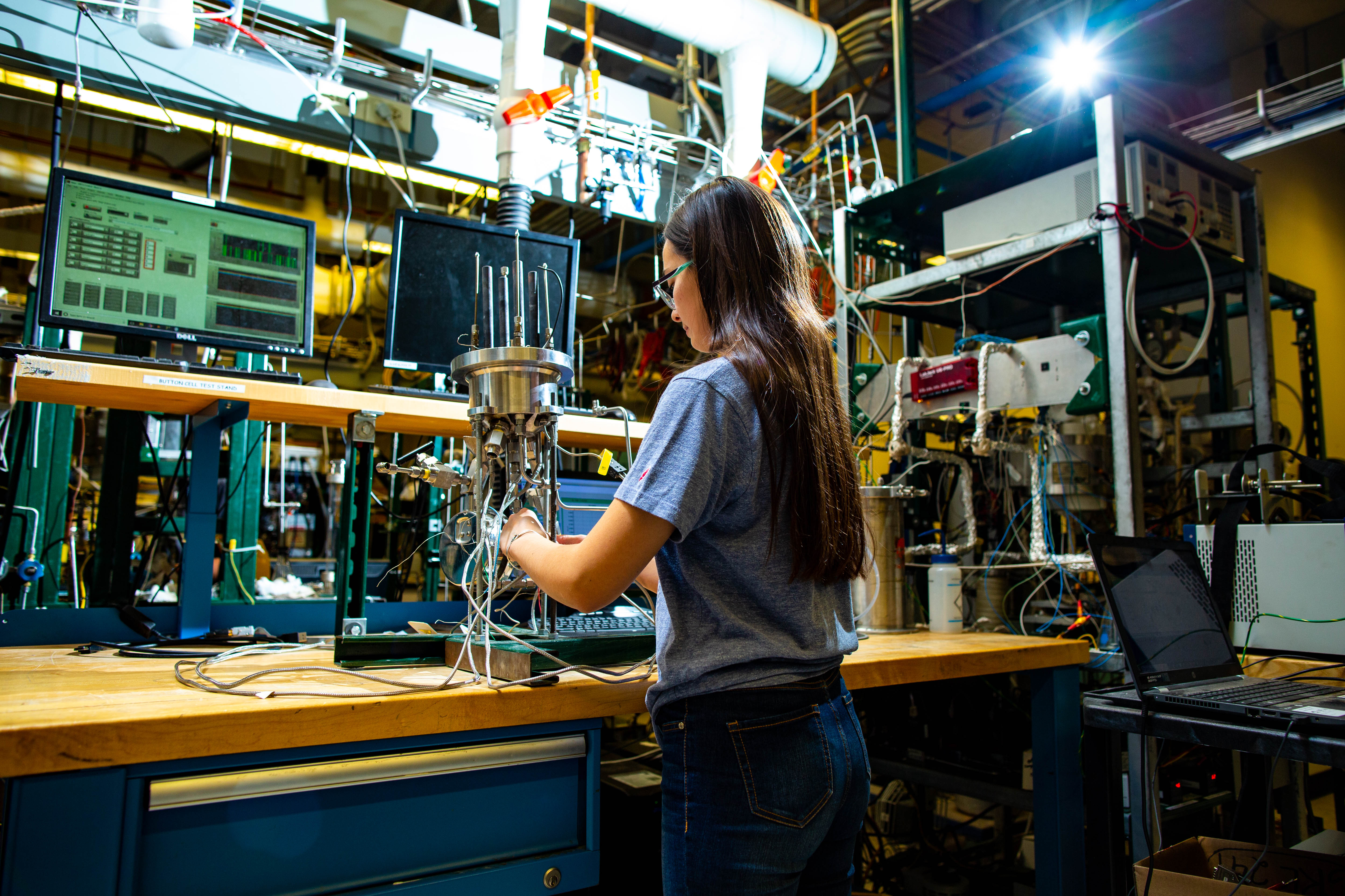 A student works at a lab bench in the Colorado Fuel Cell Center
