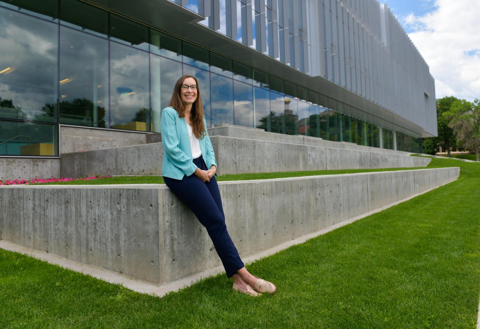 Jessica Smith standing in front of Coorstek building