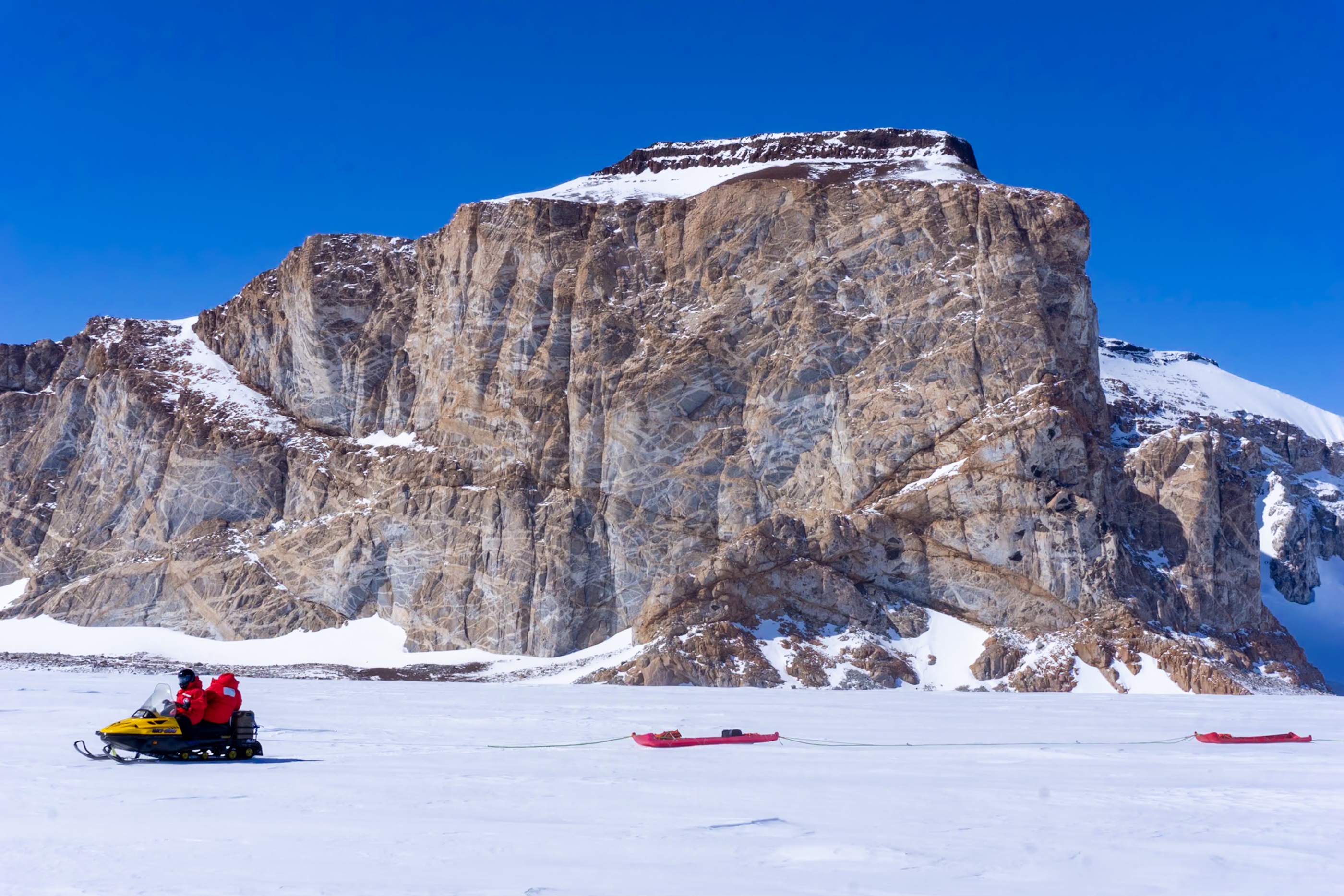 Ryan Venturelli snowmobile in Antarctica