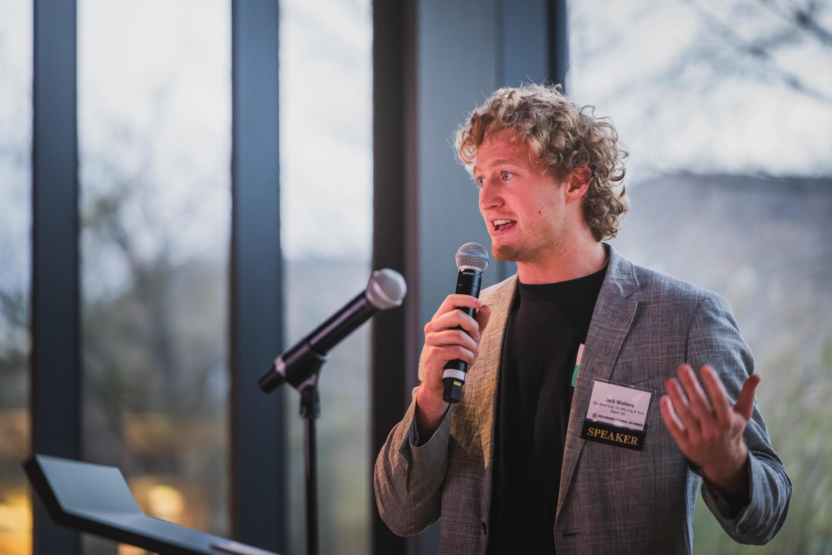Jack Walters speaks at a microphone