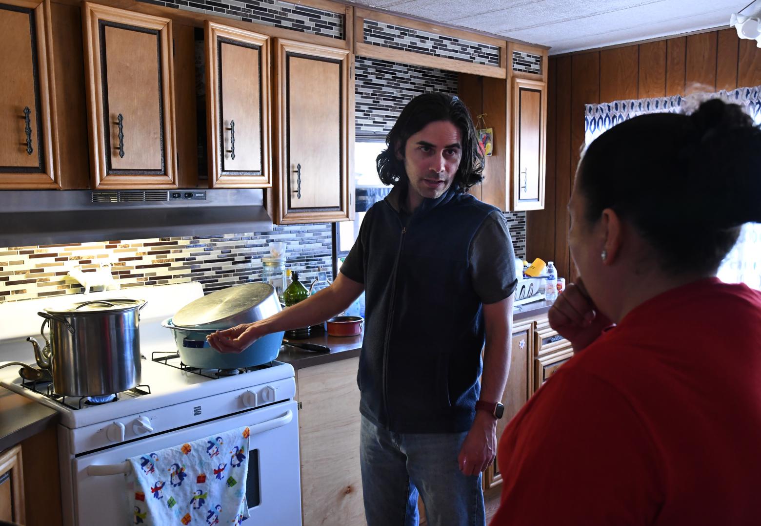 Associate Professor Paulo Tabares Velasco speaks with a resident of Lake County, Colorado to discuss energy efficiency upgrades being made to her neighborhood.