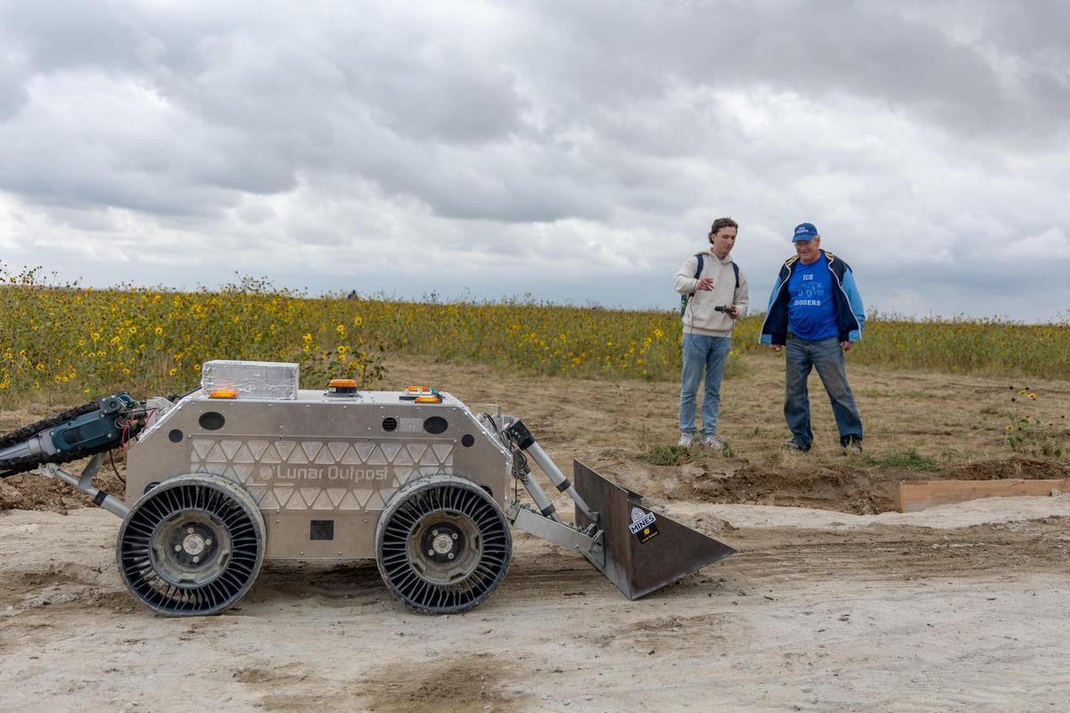 A Mines student and faculty member operate a lunar rover testing it for capabilities to enhance space travel.