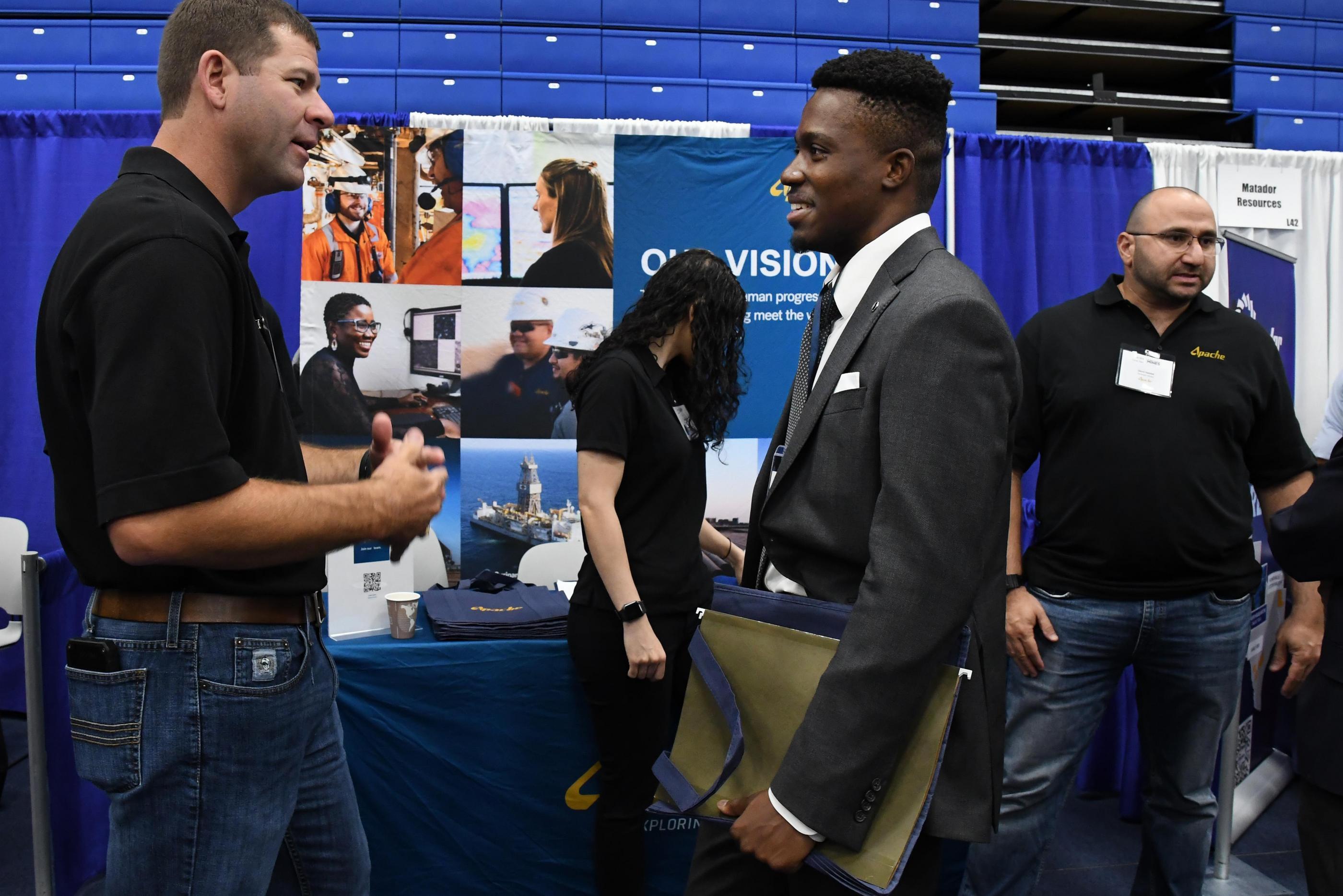 Student talks with a recruiter at Career Days