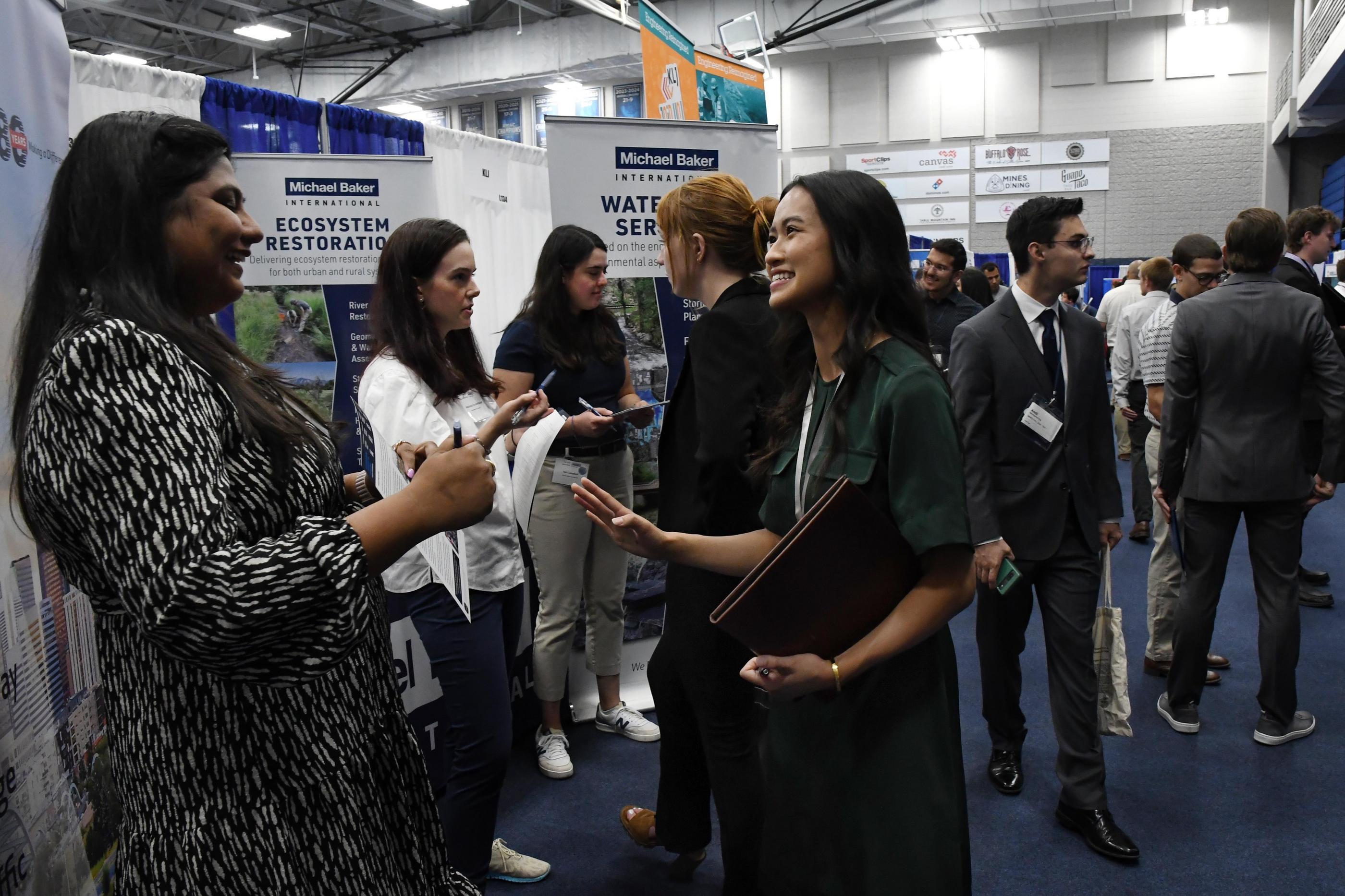 Student talks to a recruiter at Career Days