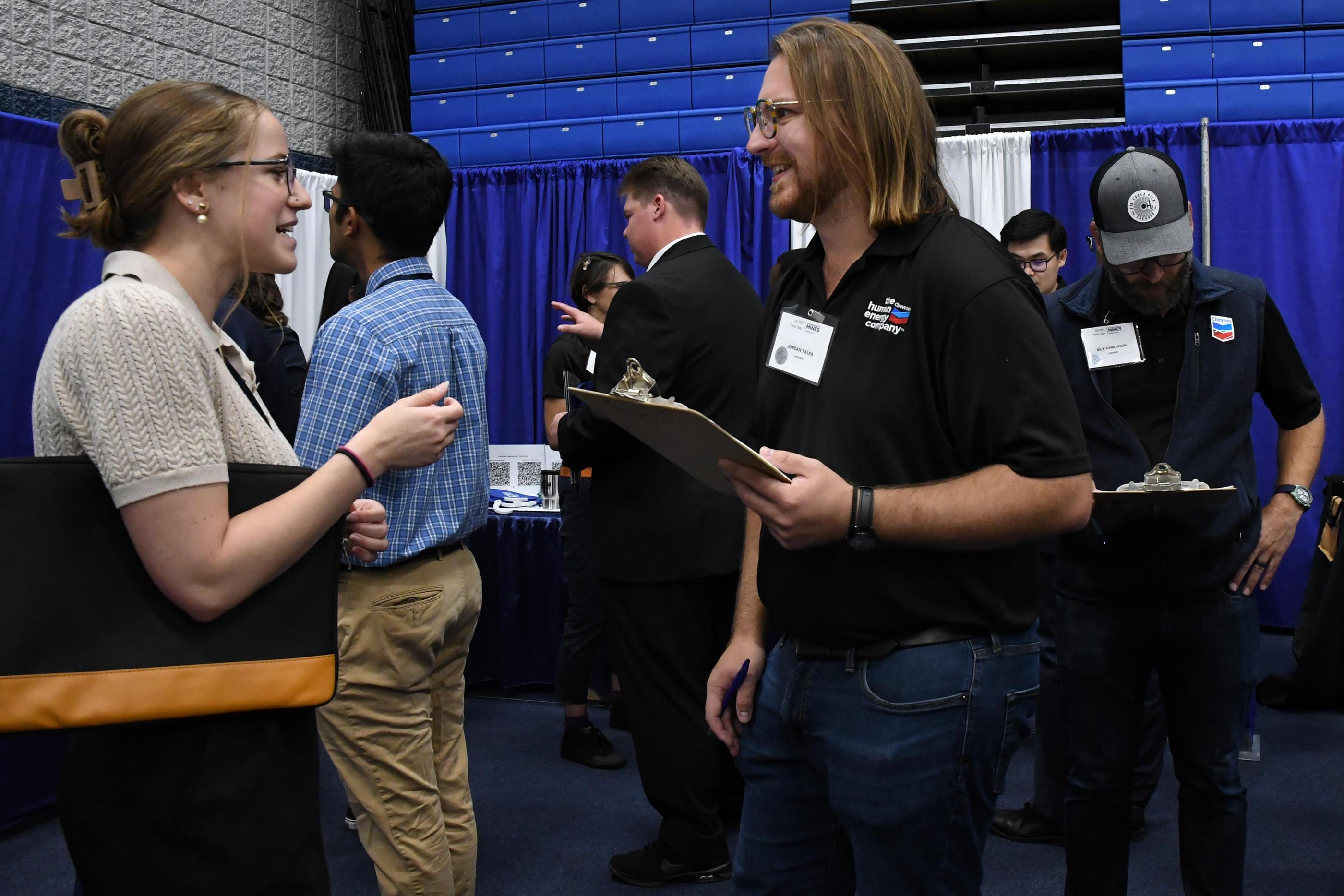 Student talks with recruiter at Career Days