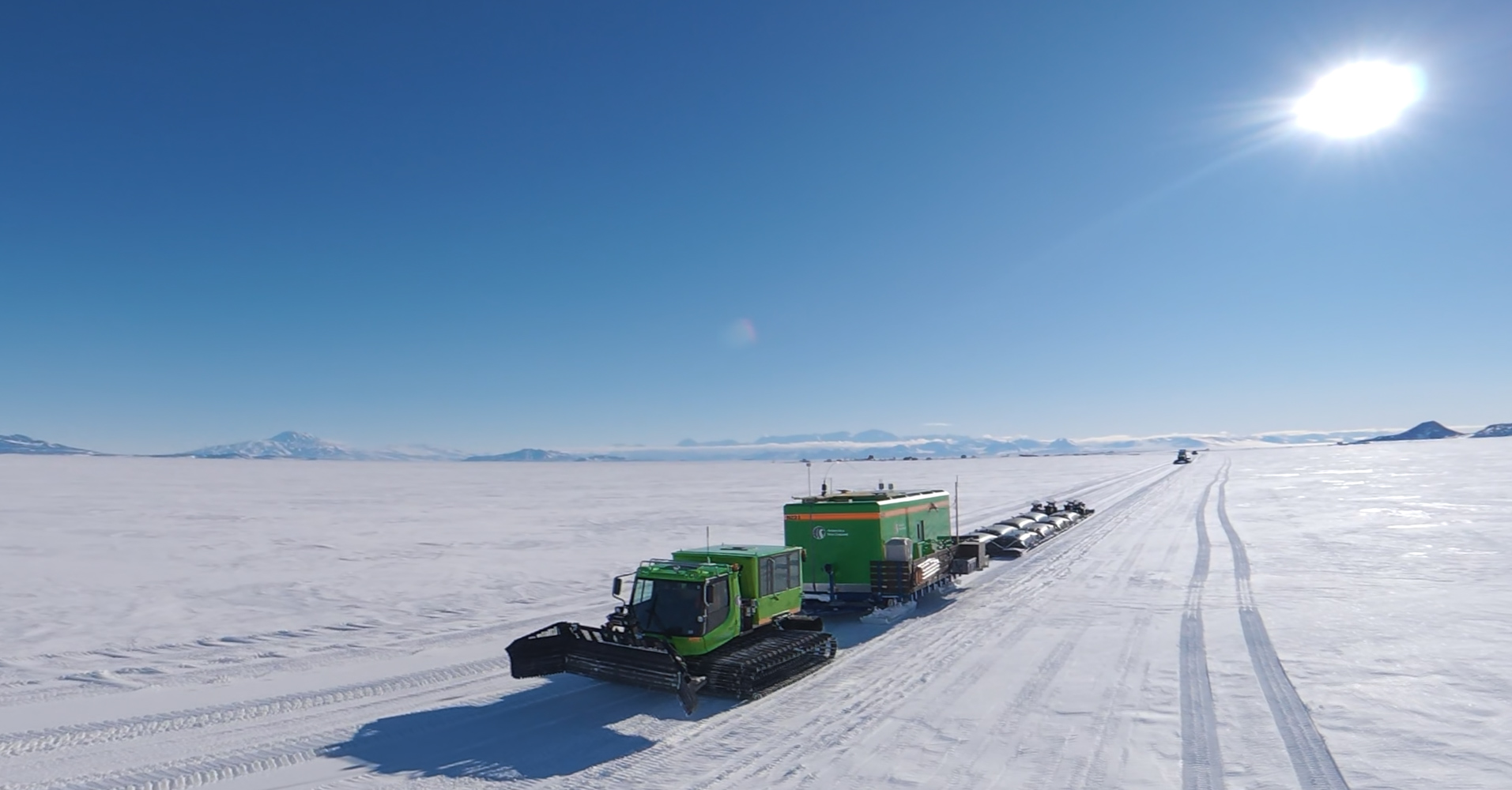 Green vehicles move out from Williams Airfield in Antarctica