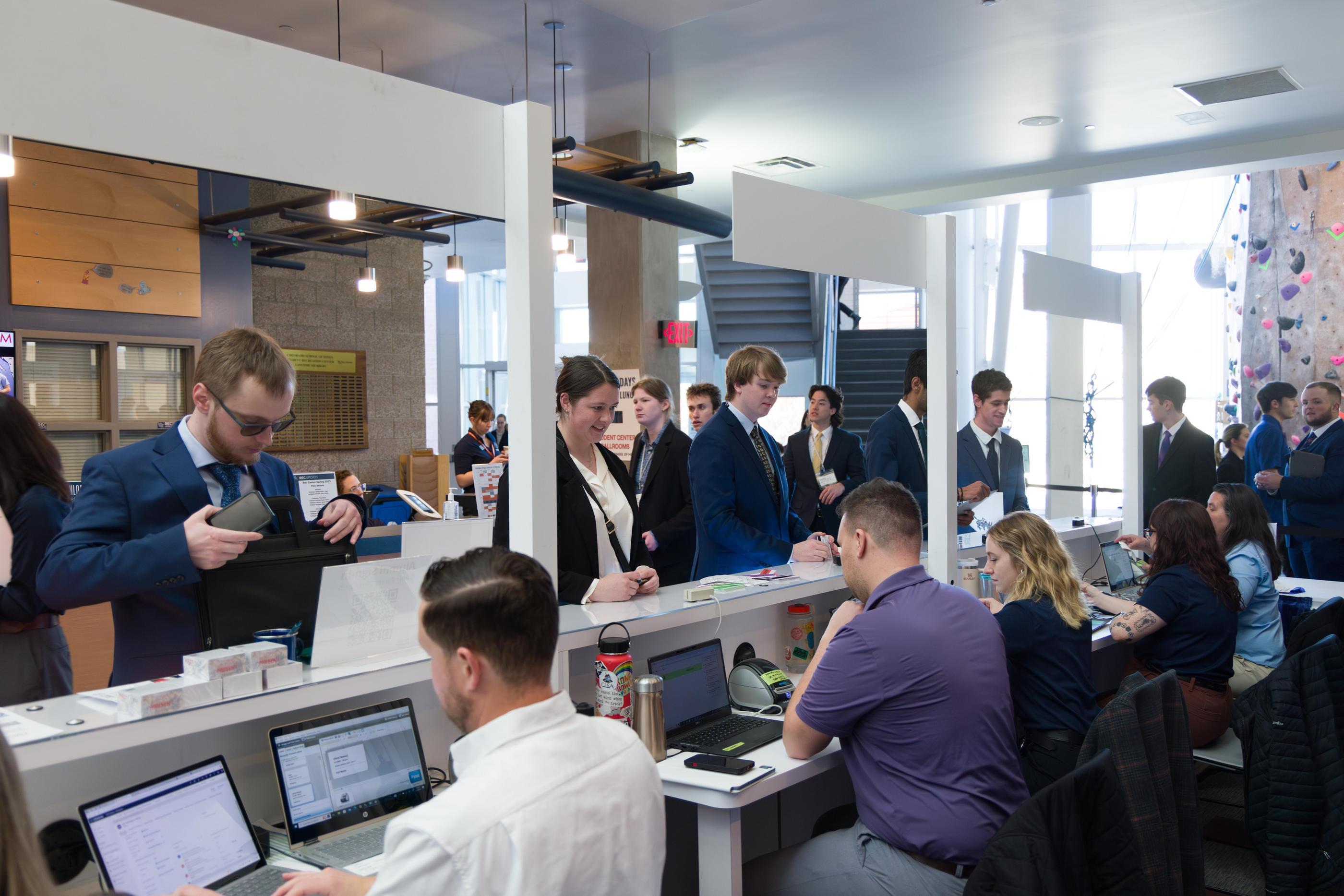 Students check in before heading into the Student Recreation Center to meet with recruiters. The Career Fair Plus app allows students to view attending companies in advance of the day, filter by specifications to find employers who fit their interests, view the booth map and more.