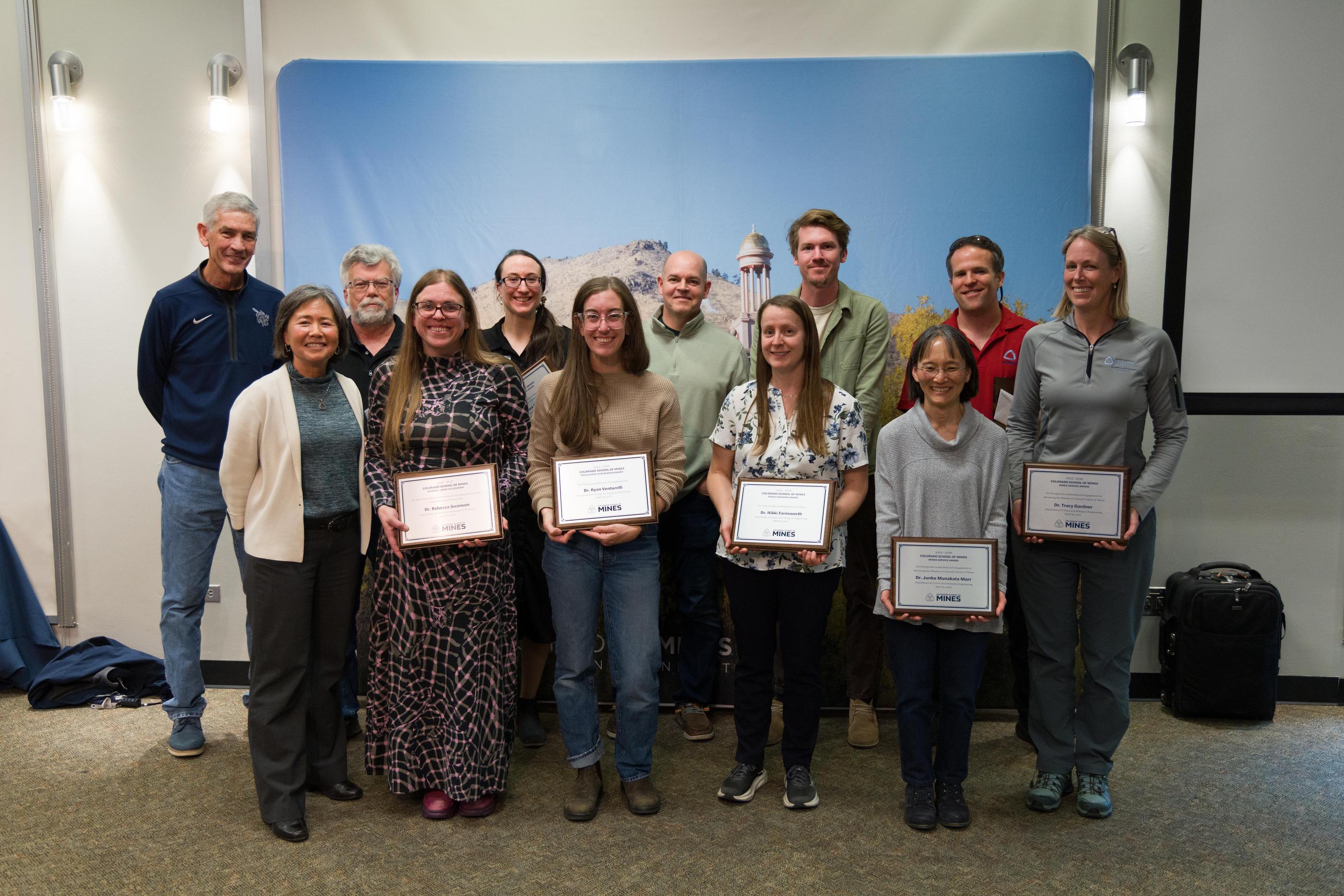 Group shot of faculty award winners with the Mines president and provost